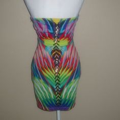 Get Ready To Turn Heads With This Stunning Bebe Mini Dress! The Strapless Design Is Perfect For Showing Off Your Shoulders, While The Sweetheart Neckline Adds A Touch Of Femininity. The Tropical Multicolor Print Is Perfect For Summer, And The Chain And Lacing Detail Down The Back Adds A Bit Of Edginess To The Look. Made Of A Polyester Blend, This Dress Is Comfortable And Perfect For Any Occasion. Whether You're Going On Vacation Or Attending A Party, This Dress Is A Must-Have. It's Available In Multicolor Summer Bodycon Dress For Evening, Strapless Multicolor Mini Dress For The Beach, Elegant Fitted Multicolor Strapless Dress, Multicolor Sleeveless Mini Dress For Cocktail, Multicolor Strapless Dress For Night Out, Multicolor Strapless Bodycon Party Dress, Multicolor Fitted Strapless Dress, Sleeveless Multicolor Cocktail Mini Dress, Chic Fitted Multicolor Strapless Dress