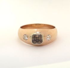 Natural Fancy Color Diamond Ring Made in USA 1.35 ct Natural Fancy Dark Brown Rectangular Diamond  with GIA Report set with 2 round colorless diamonds 0.48 cwt   in 10.8 gm 14 kt rose gold  men's ring size 11  This Ring can be resized by your jeweler. Price is negotiable.  Make us and offer. Your Satisfaction is Guaranteed. In person pickup option available.  We will partially reimburse   travel expenses upon final pickup and complete satisfaction. INV # FJ-4 More about DK Color Diamonds on Face Color Diamond Ring, Fancy Color Diamond Ring, Rose Gold Mens Ring, K Rose, Mens Ring Sizes, 3 Stone Rings, Colorless Diamond, Ring Pictures, Men's Jewelry Rings