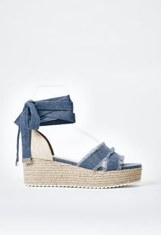 Material: Denim Heel Height: 2.25" Platform Height: 1.5" Measurements will vary slightly Closure: Adjustable Laces Imported Denim Open Toe Wedge Sandals For Vacation, Denim Wedge Sandals For Summer Vacation, Summer Vacation Denim Wedge Sandals, Trendy Denim Wedge Sandals With Platform, Trendy Denim Platform Wedge Sandals, Trendy Denim Wedge Sandals, Trendy Denim Wedge Sandals For Spring, Denim Open Toe Wedge Sandals For Beach, Beach Denim Open Toe Wedge Sandals