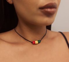 Rasta Necklace - Rasta Choker - Ethiopian Choker - Ethiopian Jewelry - Rasta Jewelry - African Choker - African Jewelry  * D E T A I L S * This Choker is made with Wooden Rondelle Beads and is strung onto Black Nylon Cord that has a lobster clasp closure.  * S I Z E * This necklace is available in the following sizes: 11 inches 11.5 inches 12 inches 12.5 inches 13 inches 13.5 inches 14 inches  Each necklace has a 2'' extender chain.  * Q U E S T I O N S *  If you have any questions, feel free to Hippie Brown Choker Jewelry, Hippie Choker Necklace, Rasta Jewelry, African Choker, Rasta Necklace, Ethiopian Jewelry, Rasta Earrings, Red Choker, Boho Choker