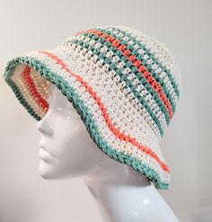 Going to the beach or getting ready to party at a music festival? This handmade Crochet Bucket Hat in Cream with Green and Orange Stripes will give you the perfect retro look. Made with 100% cotton yarn, this sun hat is lightweight to wear in the spring and summer months. Featuring a simple stripe pattern in jade green and burnt orange around the side of the hat to compliment the main cream colour, this hat will add the finishing touch to any boho outfit. The brim will also give you added protec Multicolor Hat For Summer Music Festival, White Beachy Sun Hat One Size Fits Most, Multicolor Hats For Summer Music Festival, Multicolor Summer Hat For Music Festival, Multicolor Summer Hats For Music Festival, Adjustable Retro Summer Hat, Multicolor Hats For Beach Season, Multicolor Hat For Music Festival, White Beachy Hat