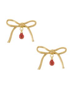 pair of gold tone earrings with red glass beads and bowknots on white background