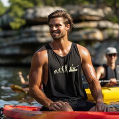 Celebrate the evolution of outdoor adventure with our Evolution to Kayaking Sleeveless Barnard Tank! This playful shirt features a humorous image of man's evolution culminating in a couple kayaking, making it perfect for kayaking enthusiasts and outdoor lovers. The unisex design ensures a comfortable fit for both him and her, making it an ideal gift for any occasion. Whether you're hitting the water, exploring nature, or simply enjoying a sunny day, this tank adds a touch of fun and style to you Sporty Sleeveless Vest For Outdoor Activities, Sleeveless Vest For Summer Outdoor Activities, Sporty Black Tops For Water Sports, Summer Casual Outdoor Tank Top, Sporty Sleeveless Outdoor Tops, Summer Casual Tank Top For Outdoor, Casual Summer Outdoor Tank Top, Casual Summer Tank Top For Outdoor, Casual Sleeveless Tank Top For Outdoor Activities