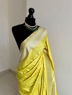 Classic and timeless Banarasi silk saree in yellow. Vibrant yellow silk saree with plain contrast blouse with border for sleeve cuffs. Rich gold zari. Perfect statement saree that's bang on trend for wedding and events. Koorai style saree for all traditional events. Rich pallu with zari and tassels, available in other colours. Blouse: plain running material with border for cuffs, unstitched Elegant Yellow Pre-draped Saree With Zari Weaving, Gold Art Silk Pre-draped Saree With Border, Elegant Yellow Traditional Wear For Festivals, Elegant Yellow Pre-draped Saree For Festive Occasions, Elegant Yellow Saree With Cutdana, Elegant Yellow Traditional Wear With Cutdana, Gold Paithani Silk Pre-draped Saree, Gold Pre-draped Paithani Silk Saree For Festivals, Festive Yellow Paithani Silk Pre-draped Saree