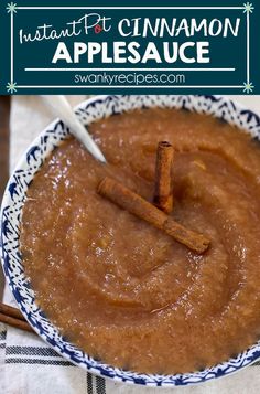 cinnamon applesauce in a blue and white bowl with two cinnamon sticks sticking out of it