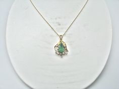 "For Sale: (1) H280 Stunning 14k Yellow Gold Emerald Necklace with Multiple Diamonds PLEASE READ ENTIRE DESCRIPTION BEFORE PURCHASING Pre-owned item. This is beautiful 14k yellow gold necklace featuring pear shaped Emerald in the center with multiple diamonds of different shape around it. No visible flaws, just some scratches please see pictures for details. Sold as is, as seen on pictures. There are earrings available that go with this necklace, and those earrings sold separately. Specifics: * Formal Hallmarked Pear-shaped Necklace, Formal Gold Emerald Necklace With Round Pendant, Formal Emerald Pendant Necklace With Diamond Cut, White Gold 14k Pear-shaped Necklace, White Gold Pear-shaped 14k Gold Necklace, Pear-shaped 14k White Gold Necklace, Gold Pear-shaped Emerald Gemstone Necklace, Fine Jewelry Custom Pendant Necklace For Wedding, Fine Jewelry Birthstone Necklace For Formal Occasions