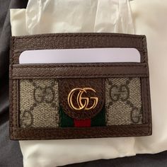 Never Used Gucci Card Holder Comes With Box And Dust Bag Chic Brown Card Holder With Card Slots, Chic Brown Card Holder With Slots, Designer Brown Rectangular Wallet, Gucci Brown Wallets With Interior Card Slots, Brown Gucci Wallets With Interior Card Slots, Gucci Brown Formal Wallet, Designer Brown Wallet, Formal Brown Gucci Wallet, Gucci Brown Bag Perfect For Gift