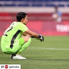 a soccer player kneeling down on the field