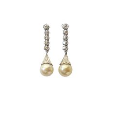 Superb and elegant Ladies Cultured Pearl & Diamond Stud  Dangle Earrings  14K White  Gold each set with 8mm medium grade capped yellowy creme colored cultured pearl, accented with five diamonds. 1 full cut @ 2.4mm 05 points and 4 single cuts @ 1.8mm 02 1/2 points L colors VS clarities ,Gold weight = 4.5 dwt / 6.99grams  1.25" approx long by 0.25" w by 0.50" D amazing in person  thanks Classic Pearl Earrings With Diamond Accents For Evening, Elegant Cream Earrings For Formal Occasions, Classic Dangle Pearl Earrings With Diamonds, Classic Pearl Dangle Earrings, Classic Formal Dangle Pearl Earrings, Diamond White Pearl Drop Diamond Earrings, Vintage Diamond Pearl Earrings For Wedding, Classic Dangle Bridal Earrings For Formal Occasions, Classic Formal Bridal Dangle Earrings