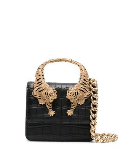 black faux leather embossed crocodile effect Tiger-sculpted top handle crystal embellishment foldover top detachable leather and chain-link shoulder strap main compartment internal logo patch gold-tone hardware concealed magnetic fastening This piece comes complete with a protective dust bag. Mini Bag Black, Black Tote, Displaying Collections, Roberto Cavalli, Black Tote Bag, Black Faux Leather, Leather Tote Bag, Embossed Leather, Leather Tote