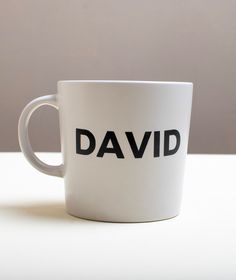 a white coffee cup with the word david printed on it