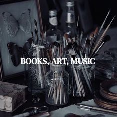 there are many books, art, music on the table