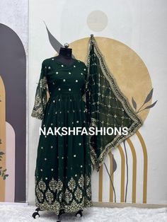 Fabric Detail*   Gown Fabric* :Faux Georgette With *Full Heavy Embroidery Sequence Work* with Sleeve*  *Gown Inner* : Micro Cotton  *Gown Size*  : *XL(42) * *(FULLY STITCHED)*  *Gown Length* : 53-54 Inches   *Gown Flair*     : 3 Meter   *Bottom Fabric* : No  *Dupatta Fabric* : Heavy Faux Georgette and *Heavy Embroidery Sequence work and Lace Border*     *Weight* :- 1 kg CARE INTRODUCTION:- HAND WASH / ONLY DRY AND CLEAN Floor-length Gown With Dori Work For Diwali, Embroidered Green Floor-length Anarkali Set, Green Embroidered Floor-length Anarkali Set, Embroidered Semi-stitched Sharara In Maxi Length, Fitted Embroidered Gown For Eid, Green Embroidered Floor-length Dupatta, Semi-stitched Gown With Pallu For Eid, Festive Embroidered Anarkali Gown, Traditional Gown With Resham Embroidery In Georgette