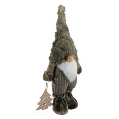 a stuffed toy gnome with a tree ornament hanging from it's back