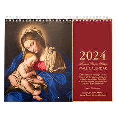 a wall calendar with the image of mary and jesus holding a baby in her arms