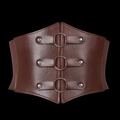 Crafted to accentuate your curves and ignite your inner shieldmaiden spirit. Inspired by the strength and resilience of Norse women, this corset belt is more than just an accessory, it's a symbol of empowerment and fearless individuality. Crafted from premium quality leather, it boasts both durability and supple comfort, ensuring it molds to your body with each wear. Versatile and striking, this corset belt is the perfect statement piece to elevate any outfit, whether you're channeling the stren Gothic Leather Corset Belt, Steampunk Leather Corset Belt For Cosplay, Leather Corset Belt For Festivals, Gothic Adjustable Corset Belt With Belt Included, Fitted Leather Corset Belt, Adjustable Gothic Corset Belt With Included Belt, Brown Leather Steampunk Corset Belt, Brown Gothic Corset Belt For Cosplay, Gothic Adjustable Corset Belt For Festivals