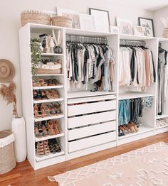 a white closet filled with lots of different types of clothes and shoes on top of shelves