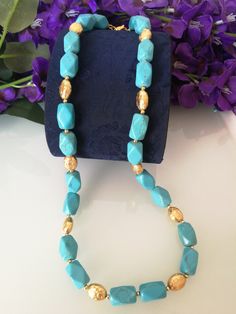 Elegant necklace choker with blue turquoise stones in octagonal shape with elements decorated in gilded brass. Measures length 60 cm. Adjustable Gold Turquoise Gemstone Necklace, Adjustable Gold Single Strand Turquoise Necklace, Adjustable Gold Turquoise Necklace With Gemstone, Bohemian Single Strand Turquoise Necklace In Gold, Gold Single Strand Turquoise Necklace For Gift, Gold Turquoise Necklace With Faceted Beads As Gift, Turquoise Faceted Necklaces For Jewelry Making, Elegant Choker, Real Turquoise