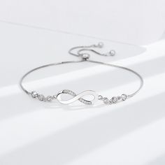 💎 Elevate Your Style with Sterling Silver: Choose the Silver-S925 option and experience the timeless beauty of the S925 Infinite Bracelet. Crafted from high-quality S925 sterling silver, this bracelet is not just jewelry; it's a symbol of everlasting connection and elegance. Luxury Silver Infinity Jewelry, Timeless White Gold Chain Bracelet As Gift, Timeless White Gold Chain Bracelet Gift, Elegant Sterling Silver Diamond Bracelet Gift, Elegant Sterling Silver Jubilee Bracelet, Timeless Sterling Silver Bracelets With Adjustable Chain, Timeless Sterling Silver Chain Bracelet Gift, Luxury Silver Infinity Bracelets, Modern Sterling Silver Cubic Zirconia Bracelet Gift