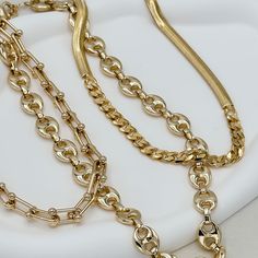 The Ryker Necklace, a timeless piece, embodies luxury and sophistication. Crafted from 18K gold filled materials, this 8mm bead link chain features a lustrous finish and a versatile 18-inch length with a 2" extender. Its refined elegance makes it a must-have for those who appreciate quality craftsmanship and style. Perfect for any occasion, it's sure to make a statement. 18" with 2" extension 18k gold filled demi-fine Luxury Refined Gold Necklace, Elegant Gold Oval Link Chain Necklace, Elegant Gold Plated Oval Link Chain Necklace, Elegant Gold-plated Oval Link Chain Necklace, Timeless Chain Link Necklaces For Everyday Luxury, Luxury Chunky Chain Necklace For Everyday, Timeless Chain Link Necklace For Everyday Luxury, Luxury Gold Plated Chain Link Necklaces, Timeless Everyday Luxury Chain Link Necklaces