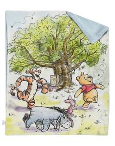 winnie the pooh and tigger fleece blanket with cartoon characters on it, in front of a tree