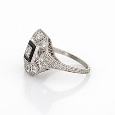 Elegant & finely detailed Art Deco era ring (circa 1920s to 1930s) crafted in 900 platinum.   Old mine and single cut diamonds total an estimated 0.75 carats (estimated at H-I colour and VS2-SI1 clarity).       The ring epitomises vintage charm and would make a lovely alternative engagement ring or right hand ring. The setting features fine milgrain detail along with a lacy filigree design in an octagonal setting. The low profile ring (5mm - 0.19 inches) sits comfortably on the finger. The side Geometric Diamond Ring, Vintage Engagement Rings Art Deco, Detailed Art, Onyx Engagement Ring, Vintage Art Deco Rings, Art Deco Wedding Rings, Art Deco Diamond Rings, Geometric Diamond, Jewelry Lookbook