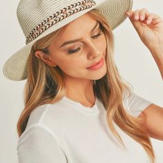 Add a touch of boho charm to your look with this stylish Straw Panama Fedora Hat! Quality crafted and accented with a Boho embroidered band, this hat is the perfect way to stay looking cool and on-trend. Plus, the suede tie accent gives it a unique touch! Material: 100% paper straw Circumference: 22" Brim length: 3.25" White Beach Fedora (one Size Fits Most), White Fedora For Beach, One Size Fits Most, White Fedora For Beach, Casual White Hat Band For Beach, Casual Lightweight Adjustable Hat Bands, Casual White Hat Band For The Beach, Adjustable Brimmed Cream Fedora, White Woven Hat Bands For Beach, White Woven Hat Band For Beach