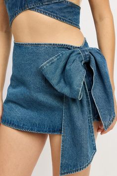 This stylish Denim Bow Mini Skirt is the perfect addition to any wardrobe. Made from high-quality denim, it features a charming bow detail that adds a touch of femininity. With its versatile design, this skirt can be dressed up or down, making it a must-have for any fashion-forward individual. SIZE & FIT :MODEL WEARS SIZE SMALLMODEL'S HEIGHT 5'9 Made In: IMPORTED Fabric Contents: 100% COTTON Skirt Bow, Denim Bows, Matching Sets Outfit, Denim Sweater, Feeling Confident, Bow Knot, Crochet Crop Top, Dresses By Length, Floral Print Tops