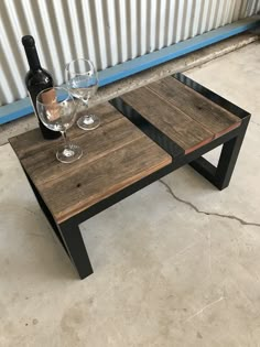 two wooden tables with wine glasses on them