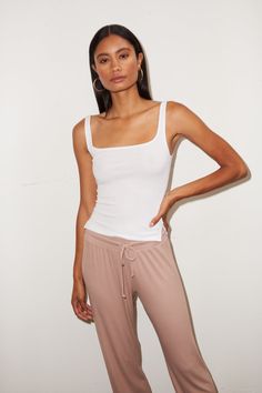 Meet your new favorite tank. The LNA Essential Ribbed Scoop Tank is perfect for tossing on with jeans or layering. Material: 95% Rayon, 5% Spandex Model is 5’ 9” and wearing a size small Sweaters Hoodies, Ribbed Tank, Ribbed Fabric, Denim Pants, Jersey Fabric, Instagram Followers, Basic Tank Top, Fitness Models, Scoop Neck