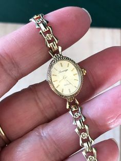 "🍀A Fine Antique Ladies Solid 9ct GOLD. 🍀9ct solid Gold bracelet.  🍀Winds and sets well and timekeeping Good.  🍀Serviced , Quartz  🍀9ct Case and 9ct gold watch band , full English hallmark  From 1970s  top cosmetics condition: 98%new(minty)  Case size 18-20mm including winding button. Collection grade! And daily wear  ship by Speed post worldwide* with no extra cost ^^ Why Vintage/ Antique jewelry & watches? 🌹Timeless Elegance:  offering a blend of vintage charm and functional sophistication. 🌹The unique and enduring appeal of owning a piece of history & heritage at your fingertips 🌹Each jewelry piece is a testament to meticulous craftsmanship, showcasing the natural brilliance the historical significance of designs.-Never scroll through online inventory at a sea of clones or copie Antique 14k Gold Watches, Timeless 14k Gold Watches, Gold 14k Hallmarked Watches, Gold Watches Gift, Timeless 14k Gold Jewelry And Watches, Hallmarked 14k Yellow Gold Watches, Timeless Hallmarked Gold Bracelet, Classic Gold Watch With Jubilee Bracelet, Oval Gold Watches For Gifts