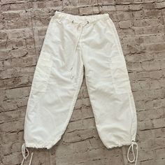 Urban Groove White Capris Pull On Waist Band ,100% Polyester Machine Washable , Size Junior Small. Never Worn. Please Check All The Photos For Measurements And Details. Bundle Of 2 Or More Items Discount. Reasonable Offers Welcome. Casual Parachute Pants With Cargo Pockets For Summer, Casual Summer Parachute Pants With Cargo Pockets, Casual Summer Cargo Pants With Drawstring, Casual Summer Parachute Pants With Pockets, White Casual Bottoms With Pockets, Casual White Bottoms With Pockets, Casual White Cargo Pants With Drawstring, Trendy Cotton Parachute Pants For Summer, Casual Summer Parachute Pants With Side Pockets