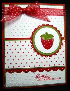 a close up of a birthday card with a strawberry on the front and polka dots on the back