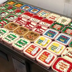 many decorated cookies are sitting on a table