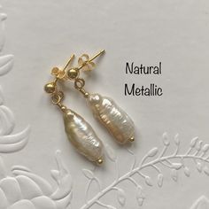 Sterling silver Biwa Pearl earrings featuring gorgeous natural metallic freshwater cultured Biwa pearls and yellow gold plated 925 sterling silver post and butterfly findings. A very simple but eye catching design! Pearls are June's birthstone making them an ideal birthday gift for June babies, wonderful for Brides or Bridesmaids or just for every day of the week. If you would like the earrings with yellow gold plated 925 sterling silver shepherd hook ear wires instead of the post and butterfly Delicate Handmade Gold Pearl Earrings, Handmade Gold Pearl Earrings As A Gift, Handmade Gold Pearl Earrings For Gift, Handmade Delicate Yellow Gold Pearl Earrings, Gold Hypoallergenic Pearl Earrings For Gifts, Delicate Handmade Yellow Gold Pearl Earrings, Dainty Handmade Gold Pearl Earrings, Pear-shaped High Luster Pearl Earrings Gift, Pear-shaped High Luster Pearl Earrings