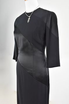 Elegance & Sophistication are exemplified in this 1940/50s EISENBERG ORIGINAL black crepe and satin dress. Diagonal wide bands show off the contrast in fabric. Elbow darts are present on the 3/4 length sleeves. Metal zipper is center back. The dress is not lined. It is in exceptional condition and a must have for the collector. EISENBERG started as a wholesaler in ladies fashion in Chicago in 1914. He was born Jonas Eisenberg in Austria, and came to the USA in the 1880s. When his sons, Sam a Classic Evening Dress With Fitted Bodice, Classic Silk Evening Dress For Formal Occasions, Classic Silk Evening Dress For Party, Classic Silk Evening Dress For Cocktail, Classic Silk Cocktail Evening Dress, Elegant Silk Evening Dress For Formal Occasions, Elegant Silk Evening Dress For Formal Events, Classic Cocktail Evening Dress With Fitted Bodice, Elegant Fitted Evening Dress For Dinner