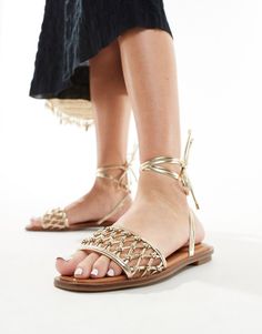 Shoes by ALDO Give your feet some airtime Knotted strap Tie-leg fastening Open toe Flat sole Gold Strappy Lace-up Sandals, Adjustable Lace-up Party Sandals, Gold Flat Heel Sandals For Spring, Gold Open Toe Sandals For Spring, Gold Ankle Strap Lace-up Sandals For The Beach, Ankle Tie Lace-up Sandals For Spring Festival, Gold Flat Heel Sandals For Vacation, Spring Festival Lace-up Sandals With Ankle Tie, Festival Lace-up Sandals