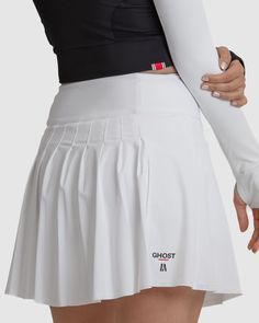 Introducing the Anika Golf Skirt, designed for a stylish and comfortable appearance on the course. Featuring built-in compression shorts with soft silicone grips, it ensures stability during swings. With its flattering silhouette and playful design, this skirt instills confidence for powerful shots. Elevate your golf wardrobe with the Anika Golf Skirt, a perfect blend of style and functionality. Fit: High-waisted design, sitting just above the belly button for a flattering silhouette. Featuring a 3 ¾” waistband with built-in tummy control for added comfort and support. Subtle A-line silhouette offers a stylish and versatile look. Front length measures 17 inches, providing ample coverage. Soft curve up at the side seam, starting at 15 ½” and gently curving back down to 17” at the back, ensu Sports Mini Tennis Skirt With Built-in Shorts, White 4-way Stretch Skirt With Built-in Shorts, Fitted Mini Skirt With Built-in Shorts For Cheerleading, White Tennis Skirt With Built-in Shorts, Fitted Mini Skirt For Tennis, White Mini Skirt With Built-in Shorts, Athleisure Fitted Mini Tennis Skirt, Fitted Mini Tennis Skirt With Moisture-wicking, Fitted Moisture-wicking Mini Tennis Skirt