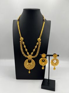 Indulge in the rich heritage of South Asia with our captivating necklace, a dazzling fusion of Indian, Pakistani, and Nepali influences. Inspired by the opulence of traditional jewelry, this exquisite piece showcases intricate craftsmanship and vibrant gemstones, reminiscent of royal adornments from the subcontinent. Embellish your neckline with its enchanting design, meticulously crafted to capture the essence of South Asian splendor. Elevate your style and embrace the cultural tapestry of Indi 22k Gold Jewelry For Diwali, Traditional 22k Gold Jewelry Sets, Traditional 22k Gold Jewelry For Celebration, Elegant Gold-plated Chandbali Jewelry Sets, Ceremonial Yellow Gold Chandbali Jewelry, Elegant Gold Plated Chandbali Jewelry Sets, Elegant 22k Gold Chandbali Jewelry Sets, Yellow Gold Chandbali Bridal Necklace For Celebration, Traditional Elegant Jewelry Sets For Ceremonial Occasions