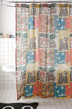 the shower curtain is decorated with cats and snowflakes