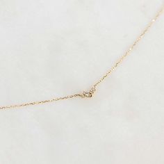 The Estrella Diamond Necklace showcases a delicate cluster of marquise and round diamonds that emit a sparkling brilliance. The necklace is set in 14k yellow gold. 


1 marquise lab grown diamond, measuring at 1.5mm x 3mm

3 round lab grown diamonds, available in three widths: 0.9mm, 1mm, and 1.1mm

Total carat weight: 0.055 

14k yellow gold chain 

Necklace has an adjustable length and can be worn at 16”, 17”, and 18” Dainty Marquise Yellow Gold Diamond Necklace, 14k Gold Marquise Diamond Necklace With Single Diamond, Marquise Single Diamond Necklace In 14k Gold, 14k Gold Marquise Diamond Necklace With Accents, Diamond Cluster Necklace, Cluster Necklace, Yellow Gold Chain, Gold Chain Necklace, Diamond Cluster