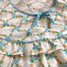 This vintage night gown is in excellent condition considering its age. The bodice features a frill and the blue and orange trellis design could not be prettier.  The label is very faded but I can make out 40 which is the equivalent of a UK size 12 however I am listing the full measurements are below to be sure; Length (shoulder to hem) 49 1/2in / 126cm Chest - 101cm / 39 3/4 inches I normally send my parcels using Mondial Relay Tracked courier service however for France only, if the item is fabric, I could use La Poste. This would be a standard lettre verte service. Please contact me prior to purchase if you would like to use La Poste and I can confirm the price. Please check out my other items Thanks for visiting Stones Online Boutique :) Vintage Ruffled Nightgown For Sleepovers, Blue Cotton Sleepwear With Ruffles, Vintage Sleeveless Ruffled Sleepwear, Vintage Ruffled Sleepwear For Spring, Vintage Ruffled Nightgown For Loungewear, Vintage Cotton Ruffled Sleepwear, Vintage Cotton Sleepwear With Ruffles, Vintage Nightgown With Ruffles For Loungewear, Vintage Floral Print Sleepwear