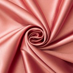 a close up shot of a pink satin fabric