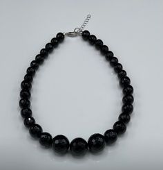 "This is a gorgeous handmade black onyx necklace. It will go amazingly with any dress or outfit. The beads are faceted and gradually getting bigger towards the end (8mm-18mm). It is great for a night out or any occasion. It will add just the right sparkle to your look. Black has been associated with regeneration and new beginnings. Black onyx is thought by some to have protective qualities, making it advantageous to carry when traveling. It is said to be useful in fighting basic fears and helpin Formal Jewelry, Black Onyx Necklace, Onyx Necklace, Necklace Statement, Necklace Black, New Beginnings, Black Onyx, Jewelry Gift, Onyx