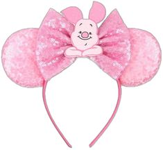 a pink minnie mouse ears headband with sequins and a bunny on it