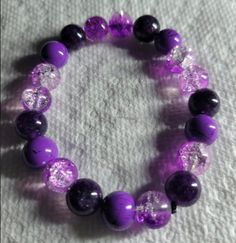 Purple and crystal bead bracelet 8mm Crystal Bead Bracelet, Crystal Bracelets With 8mm Beads, Adjustable Gemstone Beads Crystal Bracelets, Adjustable Bracelet With Faceted Beads, Elegant Purple Crystal Bracelet With Spacer Beads, Purple Crystal Bracelets With Round Beads, Crystal Stretch Bracelet With Faceted Beads, Round Beaded Crystal Bracelet, Adjustable Crystal Bracelets With Round Beads