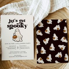 a halloween party card with ghost and pumpkins on it next to a white blanket