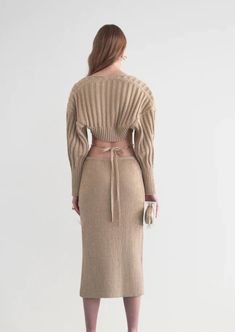 Designed by Cult Gaia. Elevate your look with the Rosie top and sweater set. Designed in a neutral-hued ribbed knit, the two-piece knit set comes with a ribbed cropped camisole and separate knit shawl to match. With a slightly oversized fit at the back bodice and shoulders, the Rosie gives you both structure and comfort. Skirt not included. Fit: Model is 5'9" and is wearing a size Small. Slim fitting bralette with slightly oversized shawl. Stretchy rib knit. Materials + Care: 100% Cotton. hand w Knitting Fashion, Knitwear Inspiration, Cropped Camisole, Knit Shawl, Cult Gaia, Black Women Fashion, Knitted Shawls, Sweater Set, Winter 2024