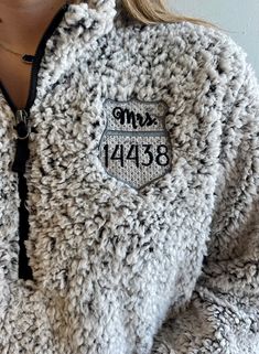 a close up of a person wearing a jacket with the number 7438 on it