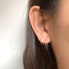 "Simple small dainty hoop earrings, made from from wire. Every single piece is handmade so it might slightly look different from each other. 1 PAIR Thickness: 20 gauge/0.8mm Material & color: 1. Copper plated wire, nickel free 2. Sterling silver, 14k Gold filled and 14k Rose gold filled Choose your options Size 14mm/0.55\" Size 17mm/0.67\" Mixed, 1piece 14mm and 1piece 17mm When putting them on please take your time, give a slight twist and ease through pierce hook into the eye loop and secu Hypoallergenic Open Circle Hoop Earrings For Gift, Gift Single Open Circle Hoop Earring, Dainty Hoop Wrap Earrings As Gift, Dainty Everyday Threader Earrings, Simple Small Hoop Earrings For Pierced Ears, Simple Small Hoop Ear Wire Earrings, Minimalist Small Hoop Threader Earrings, Nickel Free Hoop Cartilage Earrings For Everyday, Delicate Huggie Cartilage Earrings With Ear Wire